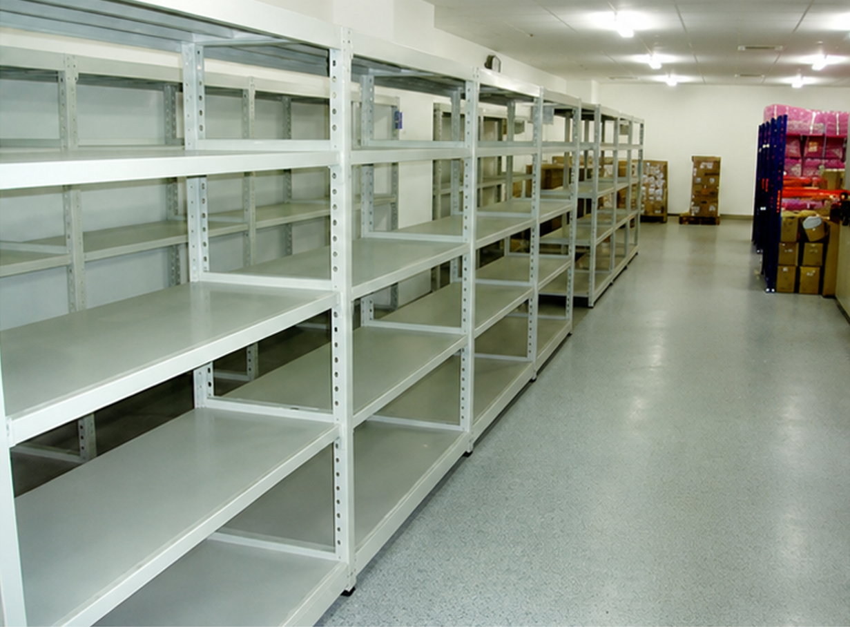 White empty warehouse storage shelving installed in organized aisle